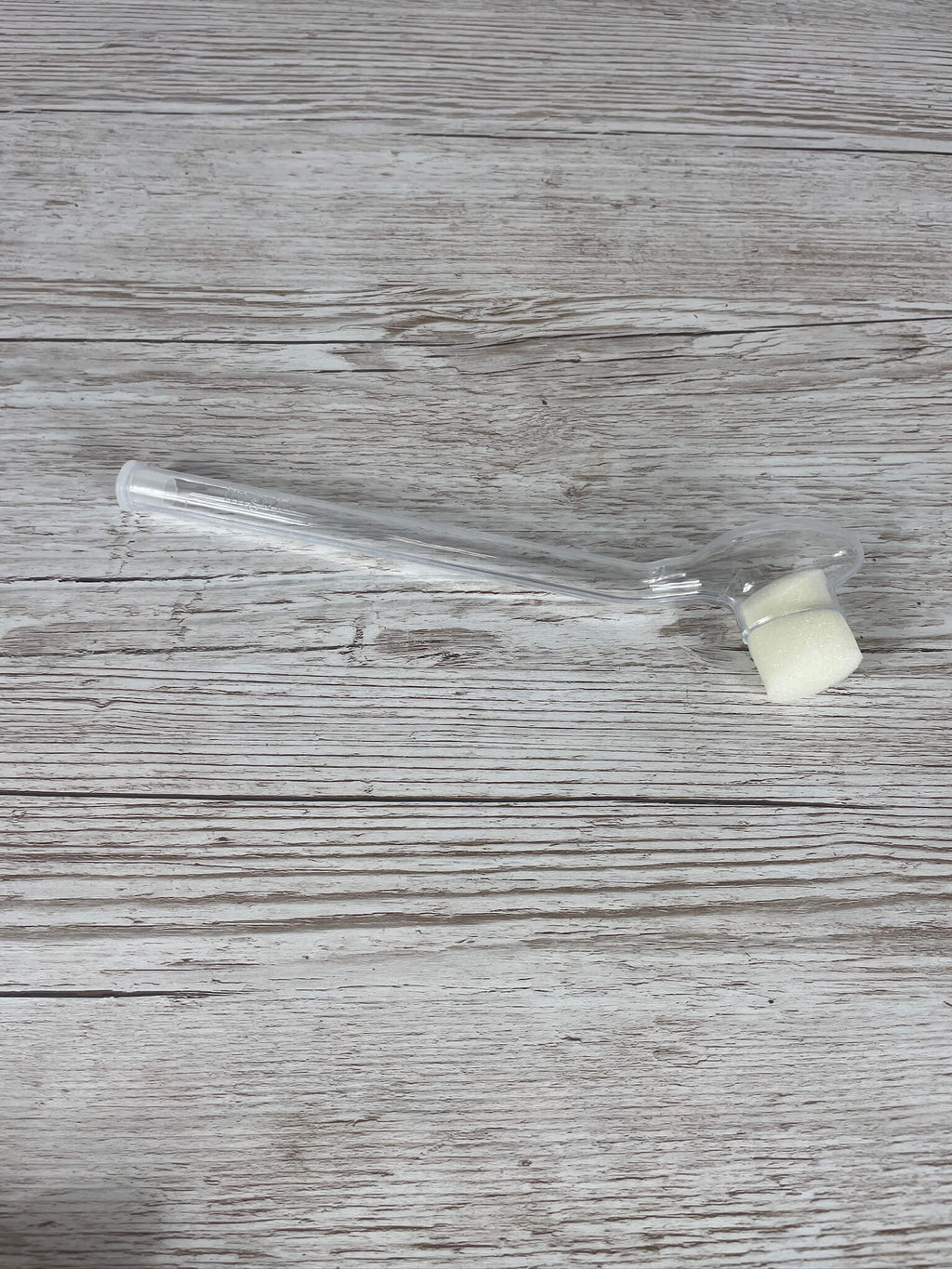 Das komplette Imgut Abfangglas IDEAL flach liegend mit eingesetztem Schaumstoffstopfen und Endhütchen.