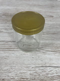 Geschlossenes 500g Neutralglas mit glatter Oberfläche und goldenem Twist-Off-Schraubverschluss